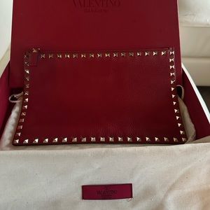 Valentino Red Studded Pouch with gold studs in pristine condition.